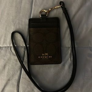 Leather Coach Two credit card slots, ID window. Detachable landward.